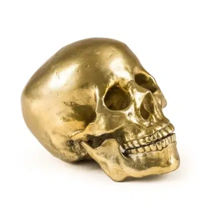 Gold human skull sculpture in cast aluminum