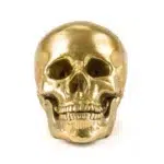 Close-up of gold human skull sculpture detail