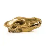 Close-up of gold wolf skull sculpture jaw detail