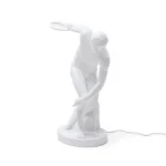 Table Lamp Discus Thrower, shown on a console table