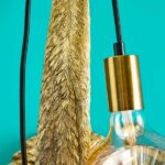 Wall Lamp Flamingo Gold, shown mounted in a living room