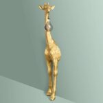 Floor Lamp Giraffe Gold, close-up detail of the shiny gold finish