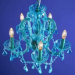 Glass Chandelier Aurora Blue, shown mounted over a dining table
