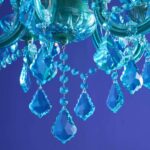Glass Chandelier Aurora Blue, shown mounted over a dining table