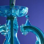 Glass Chandelier Aurora Blue, shown mounted over a dining table