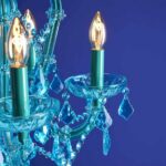 Glass Chandelier Aurora Blue, shown mounted over a dining table