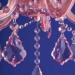 Glass Chandelier Aurora Pink, shown mounted over a dining table