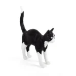 Table Lamp Cat Standing Black and White, shown on a console table