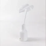 Table Lamp Palm Leaf, shown on a windowsill