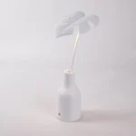 Table Lamp Palm Leaf, shown on a windowsill