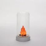 Table Lamp Miniature Scene Bonfire, shown on a nightstand