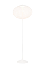 Globe floor lamp illuminated, showing woven texture