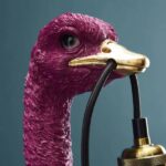 Wall Lamp Ostrich Magenta, shown mounted in a hallway setting