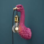 Wall Lamp Ostrich Magenta, shown mounted in a hallway setting