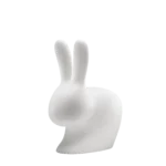 Rabbit lamp being used as a low seat