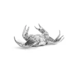 Gold crab sculpture styled on a console table