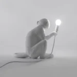 : Table Lamp Monkey Sitting White, illuminated view