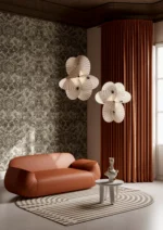 Sculptural pendant light illuminated, showing spiral form