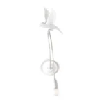 Wall Lamp Sparrow Landing, shown mounted beside a headboard