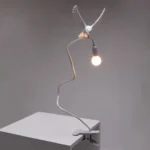 Table Lamp Sparrow with Clamp, shown clamped to a shelf