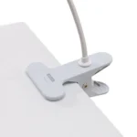 Table Lamp Sparrow with Clamp, shown clamped to a shelf