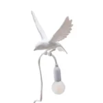 Table Lamp Sparrow with Clamp, shown clamped to a shelf