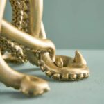 Table Lamp Octopus Gold, shown on a bedside table