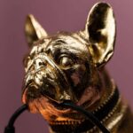 Table Lamp Bulldog Gold, shown on a sideboard