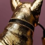 Table Lamp Bulldog Gold, shown on a sideboard