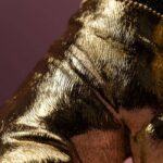 Table Lamp Bulldog Gold, shown on a sideboard