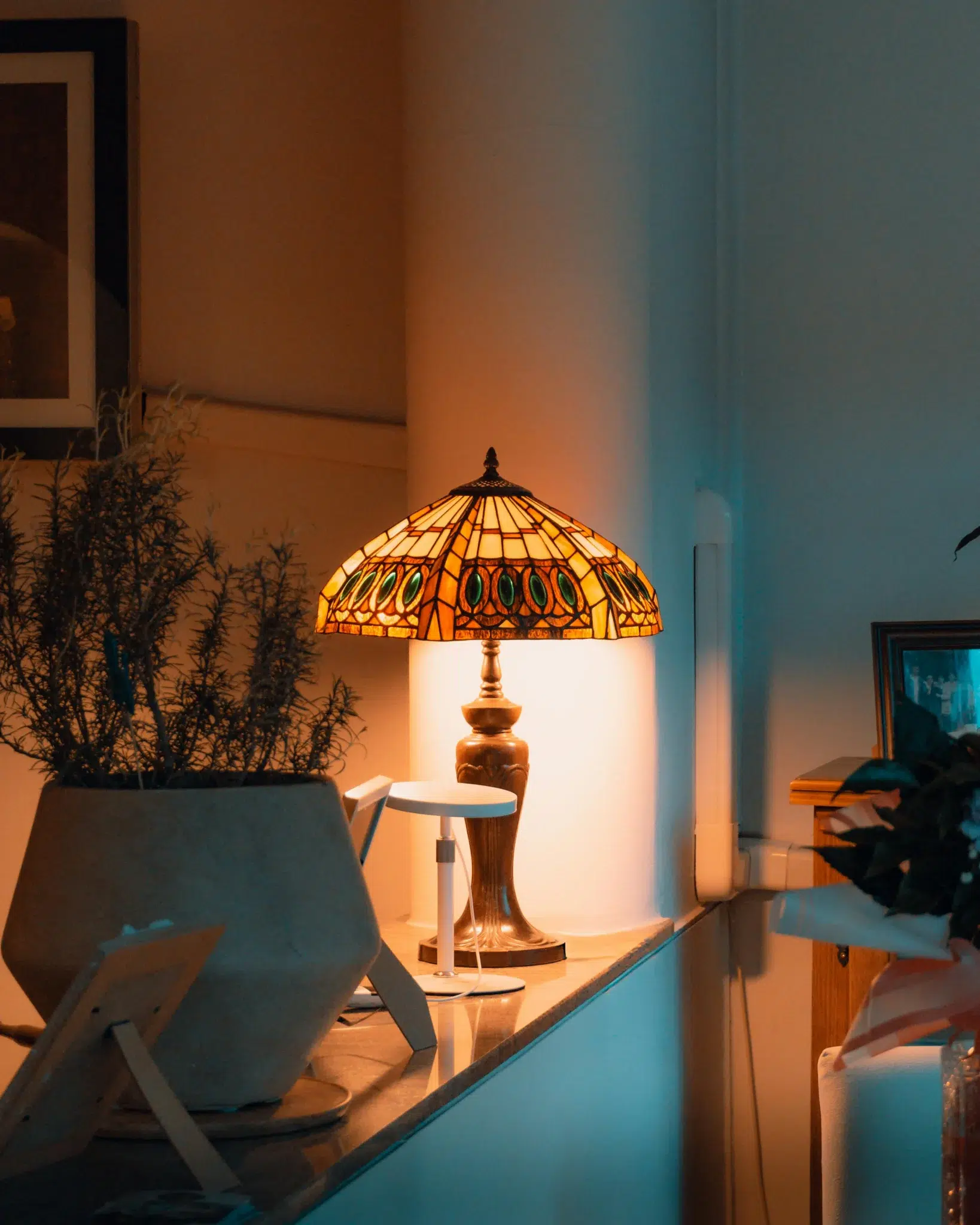 Artistic table lamp with a Tiffany-style shade illuminating a modern interior