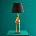 Table Lamp Horse Gold, shown in a living room