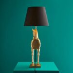Table Lamp Horse Gold, shown in a living room