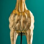 Table Lamp Horse Gold, shown in a living room