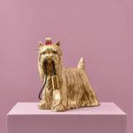 Table Lamp Dog Gold, shown on a sideboard