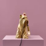 Table Lamp Dog Gold, shown on a sideboard