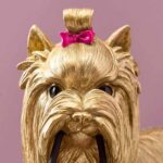 Table Lamp Dog Gold, shown on a sideboard