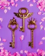 Close-up of gold power key sculpture finish