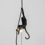 Ceiling Lamp Monkey Black, shown hanging in a living room