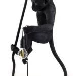 Ceiling Lamp Monkey Black, shown hanging in a living room