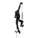 Wall Lamp Monkey Hanging Black, full front view of the monkey sculpture