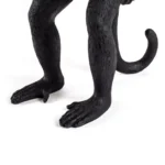 Table Lamp Monkey Standing Black, shown in a living room