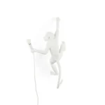 Wall Lamp Monkey Hanging White, shown mounted above a buffet