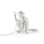 : Table Lamp Monkey Sitting White, illuminated view