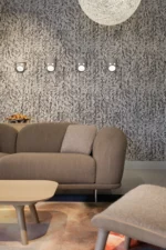 Cast ceramic face wall sconce, front view