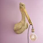 Wall Lamp Pelican Gold, shown mounted in a stairwell