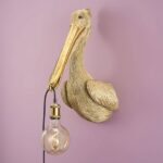 Wall Lamp Pelican Gold, shown mounted in a stairwell