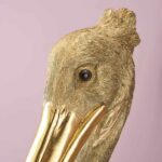 Wall Lamp Pelican Gold, shown mounted in a stairwell