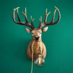 Wall Lamp Stag Brown, shown mounted in a living room