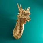 Wall Lamp Dragon Gold, illuminated view showing the visible bulb